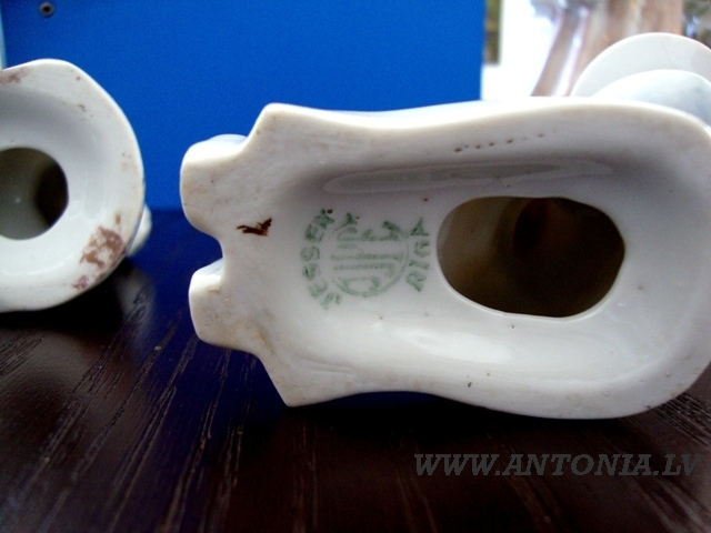 A pair of figural candlesticks