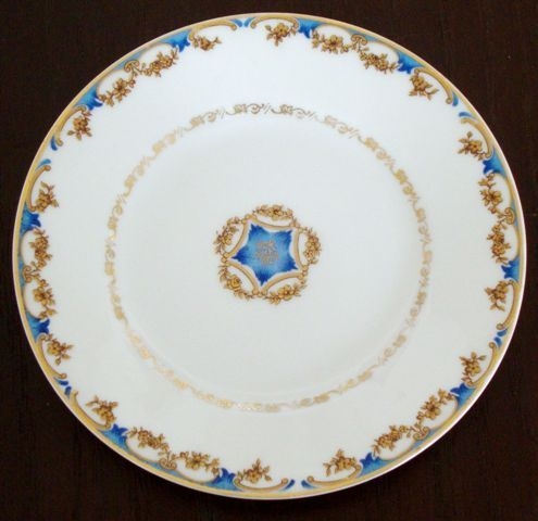 A cup with blue and gold flowers