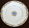 A cup with blue and gold flowers